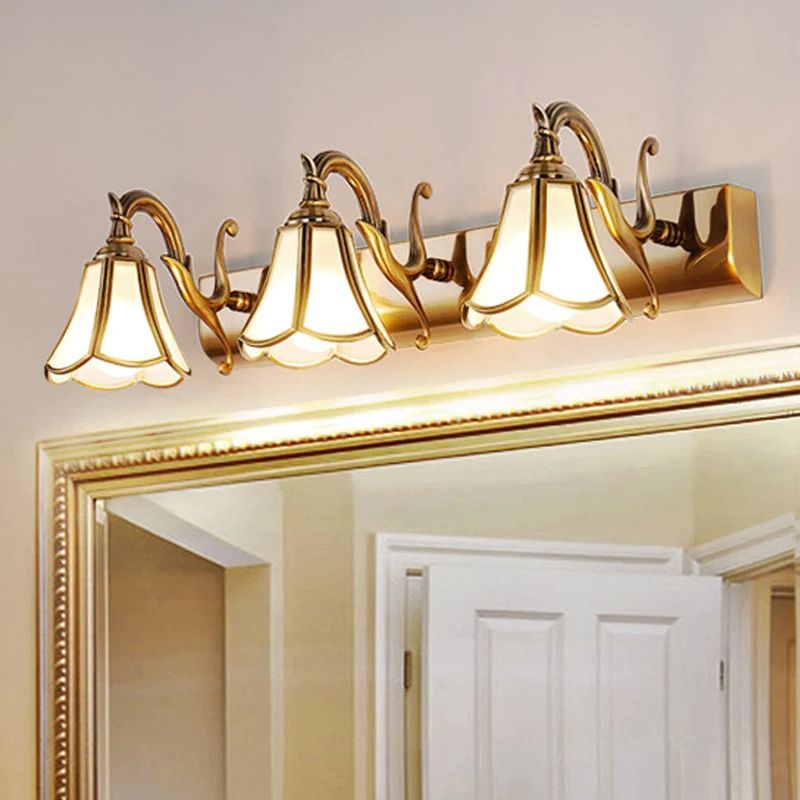 How wide should a vanity light be compared to a mirror?